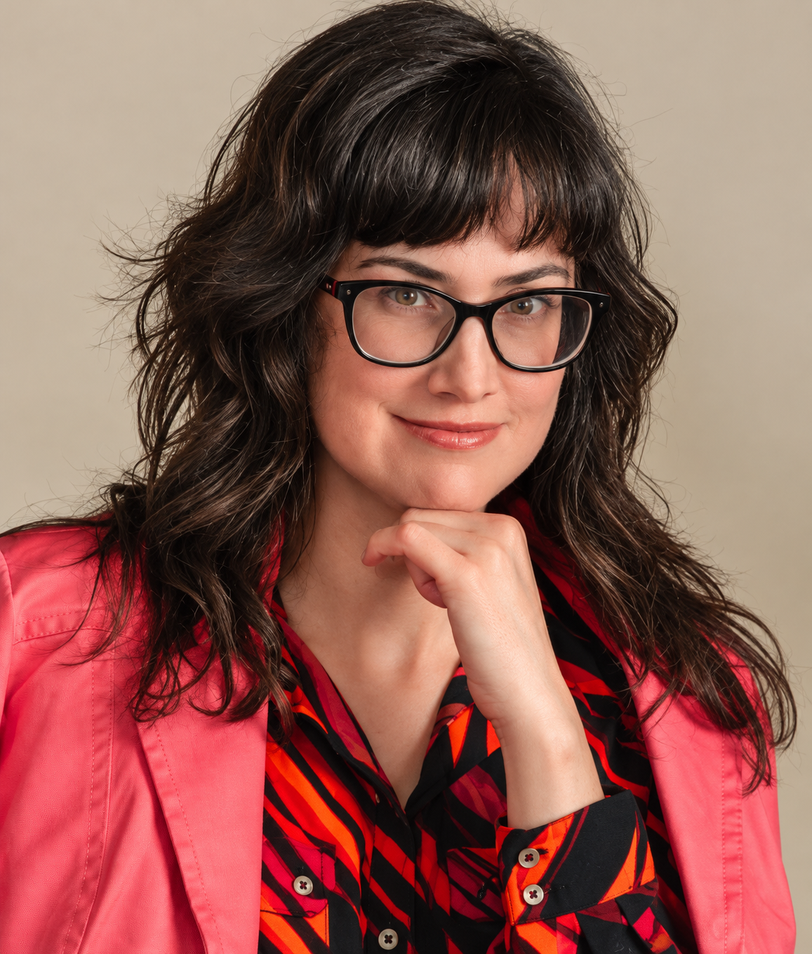 Confident Woman in Coral Blazer